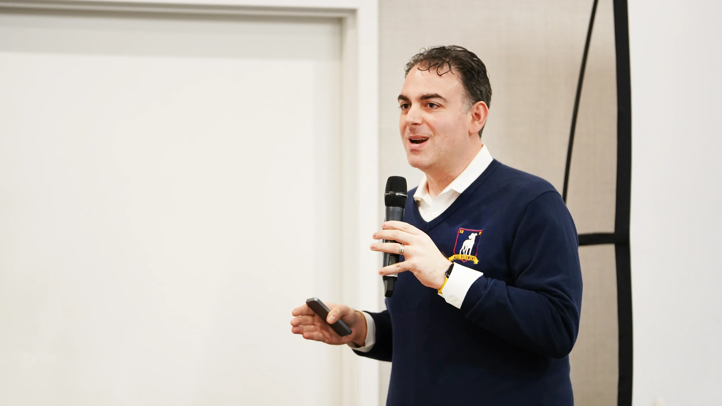 Mark Mohammadpour, offsite facilitator, speaks with a group of executives.