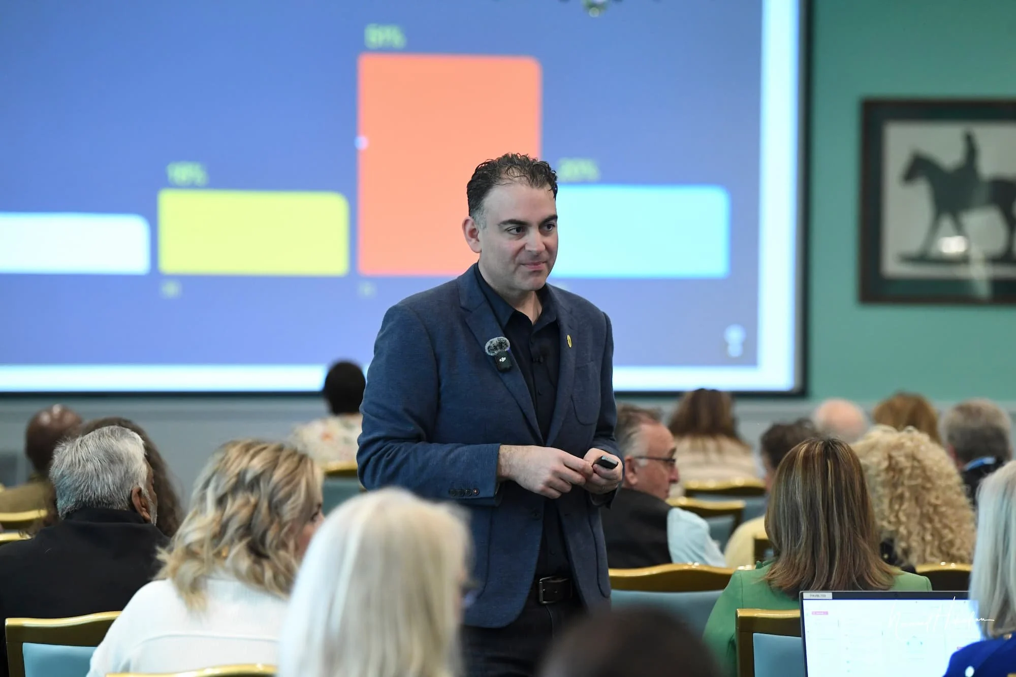 Man is listening to audience.