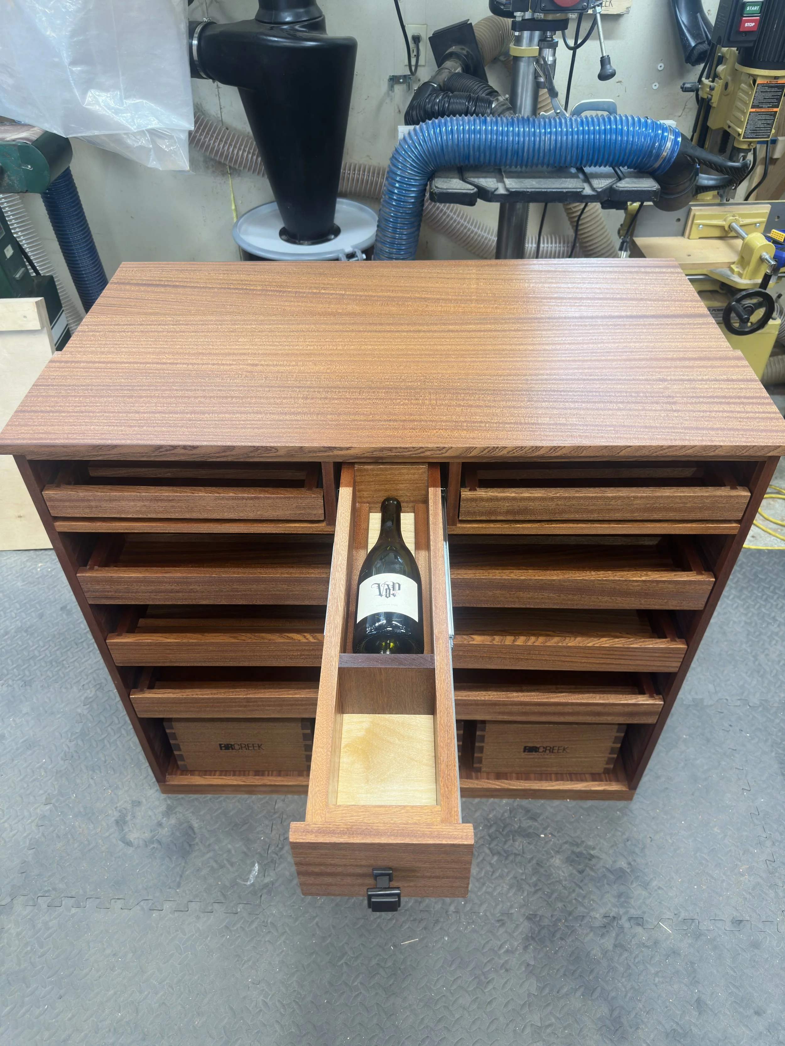 dovetail center drawer with wine key slot in front 