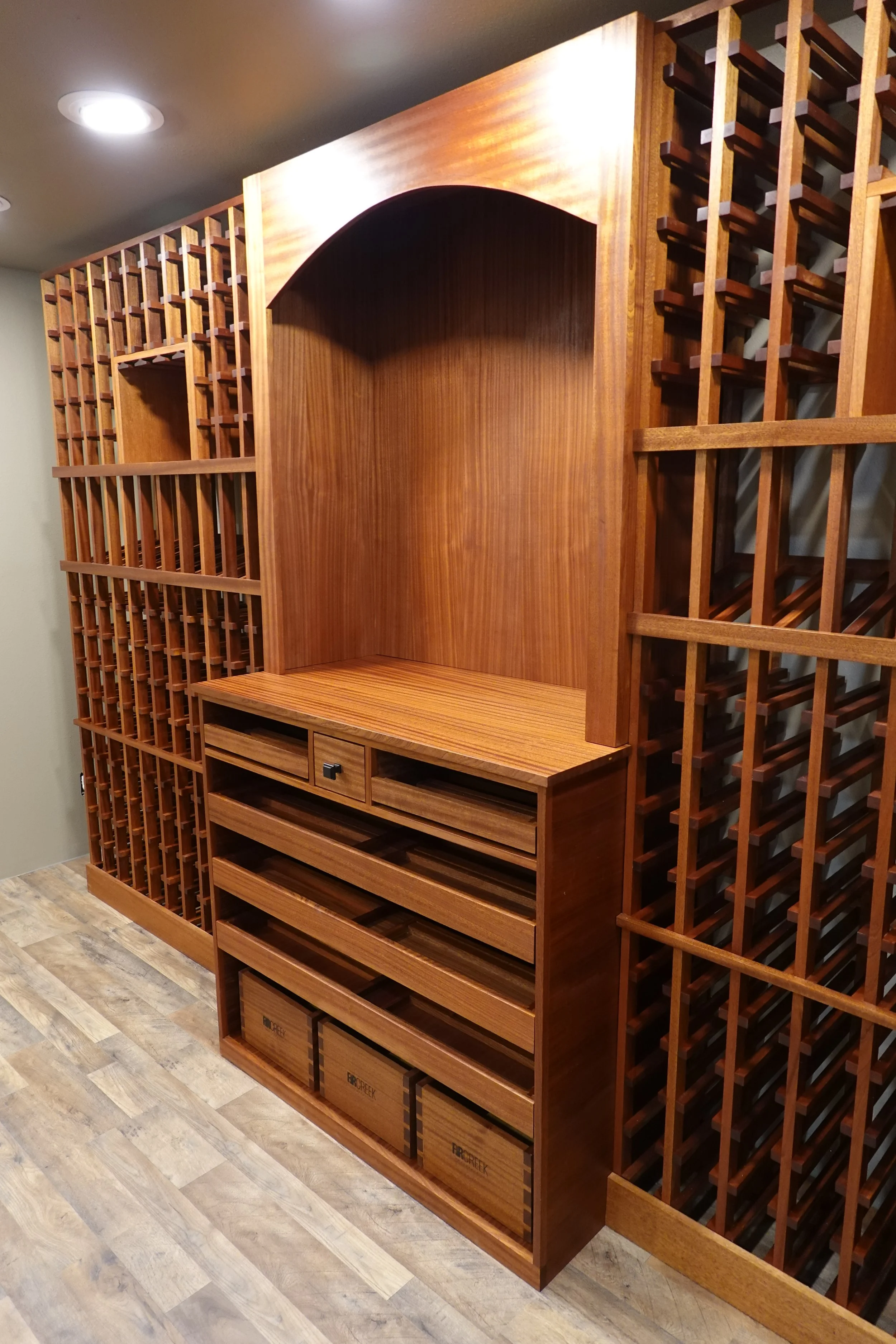 The reveal on the display case and cabinet adds texture.  Crown molding will be installed  after the other two walls of racks are commissioned .  