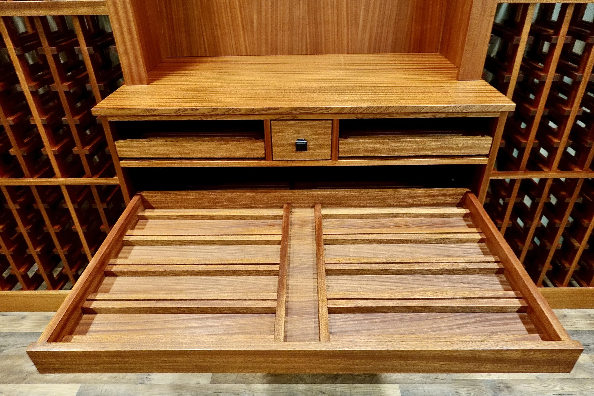This drawer has space for 4 magnums on each side and 1  extra long magnum in the middle  