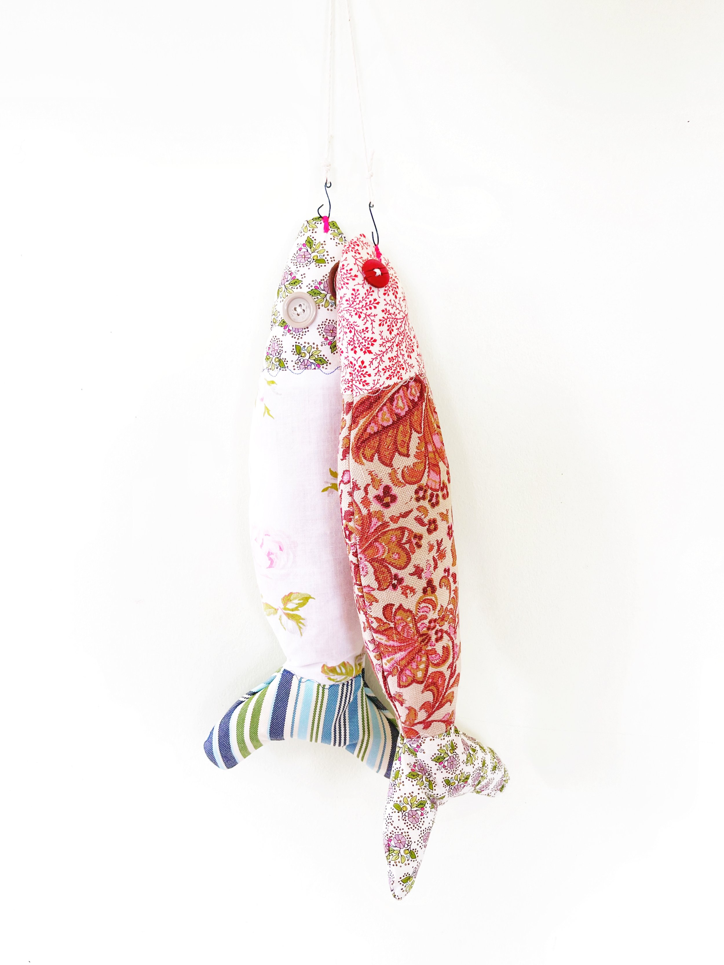 Cedar stuffed & hand sewn with vintage scrap material to create closet fish - to repel any clothes destroying critters.
