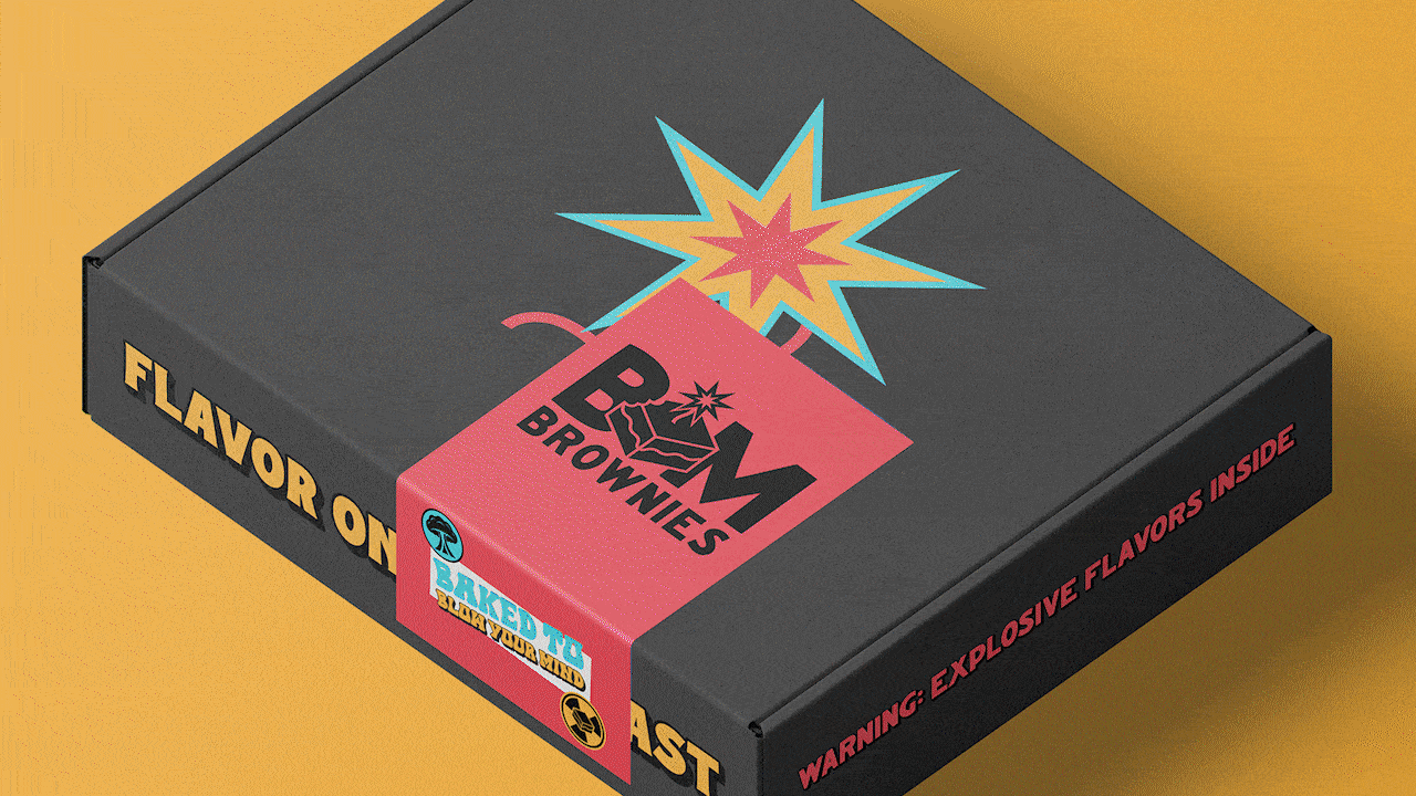 Black box of B&M Brownies with colorful explosion graphic on top, pink label on side reading "Baked to Blow Your Mind", and warning about explosive flavors inside.