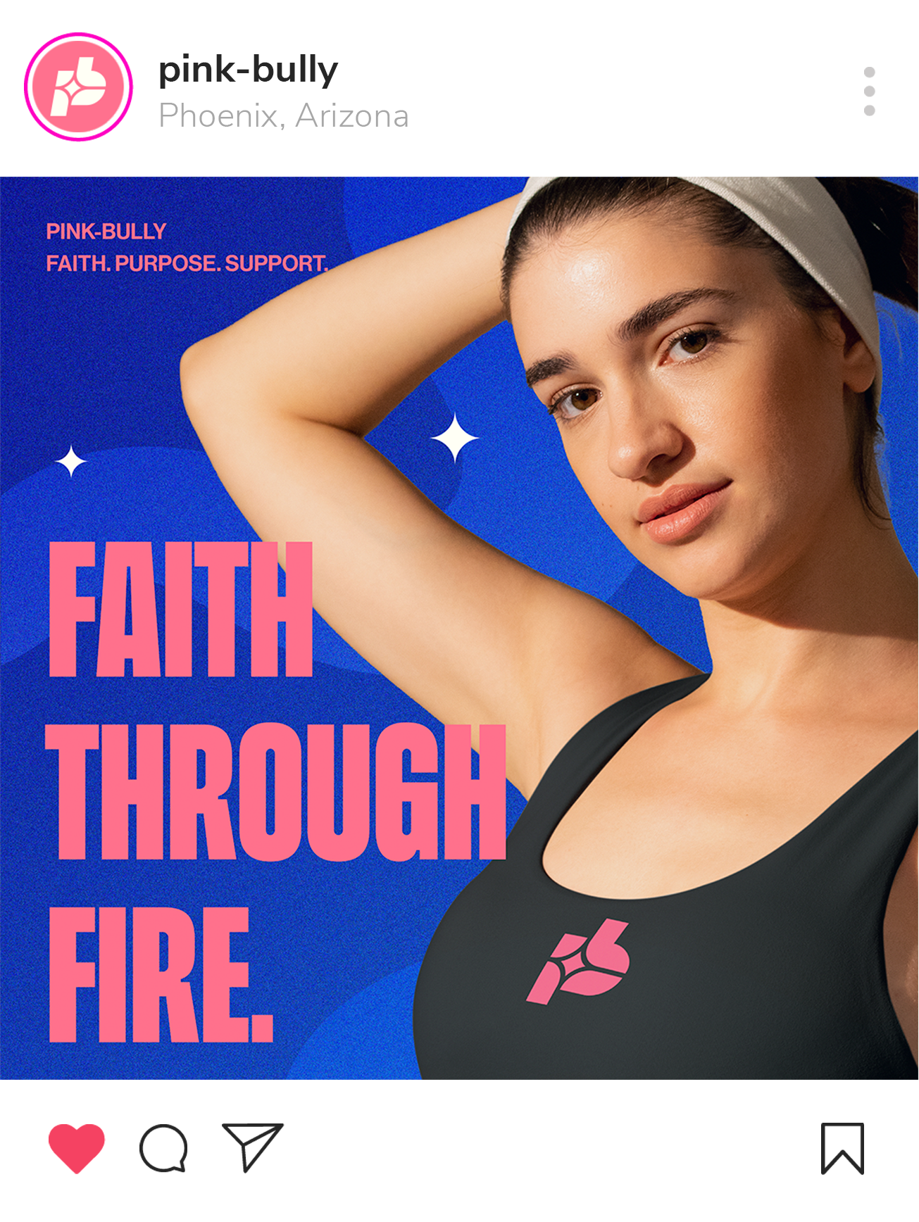 A woman with dark hair wearing a gray headband and black top with pink logo, posing against a blue background with text that reads "Faith through fire" and "Pink Bully Faith. Purpose. Support."