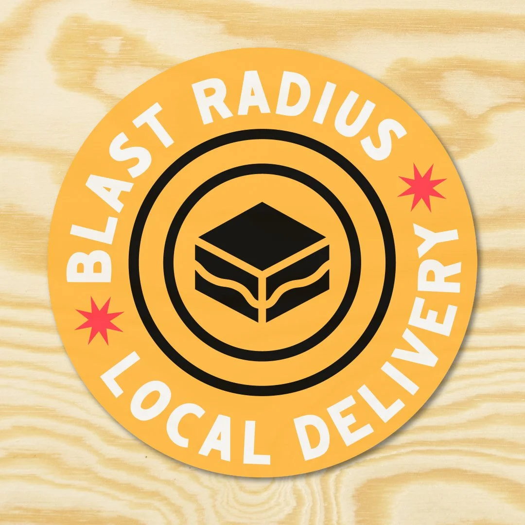 Sticker with orange background and black sandwich icon in the center, surrounded by white text 'BLAST RADIUS LOCAL DELIVERY' and two red starbursts.