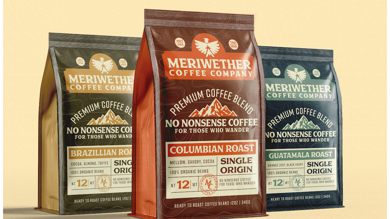 Three packages of Meriwether coffee, featuring Brazilian roast, Colombian roast, and Guatemala roast, standing side by side on a flat surface.