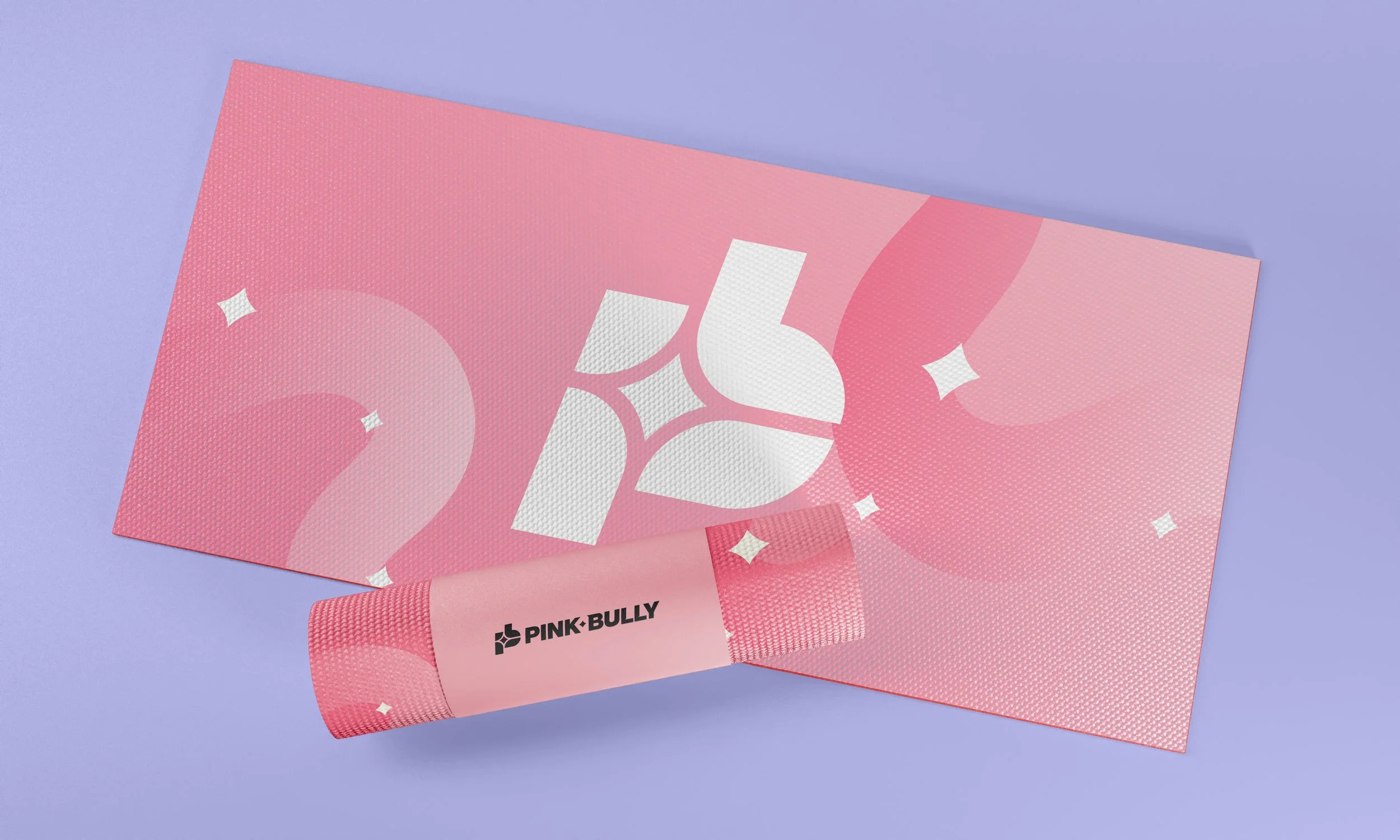 Pink Bully advertising material with decorative white floral and star patterns on pink textured paper, set against a light purple background.