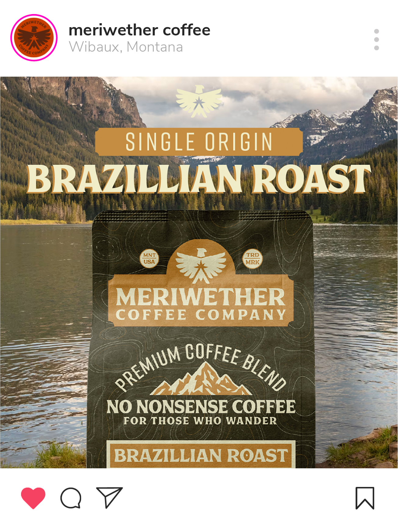 A package of Meriwether Coffee Company's Brazilian Roast coffee against a lakeside background with mountains and cloudy sky.