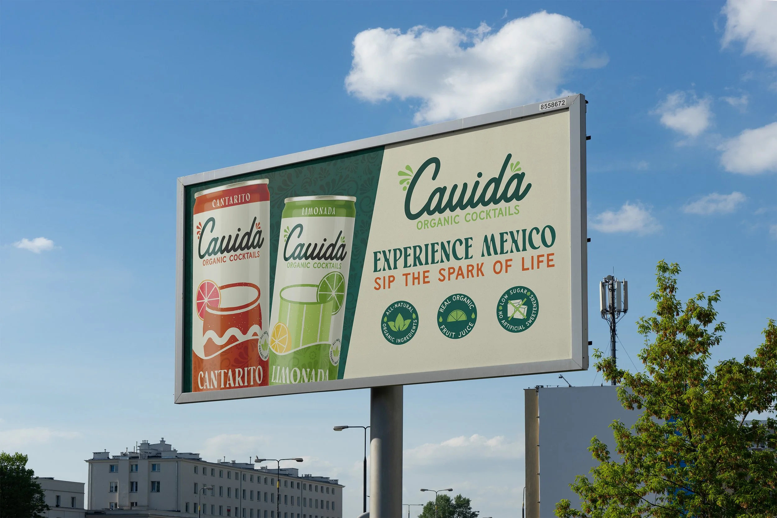 Billboard advertising Cauda organic cocktails, featuring cantarito and limonada flavors, with the slogan 'Experience Mexico, Sip the Spark of Life' and icons promoting natural ingredients, organic fruit juice, and low sugar options.