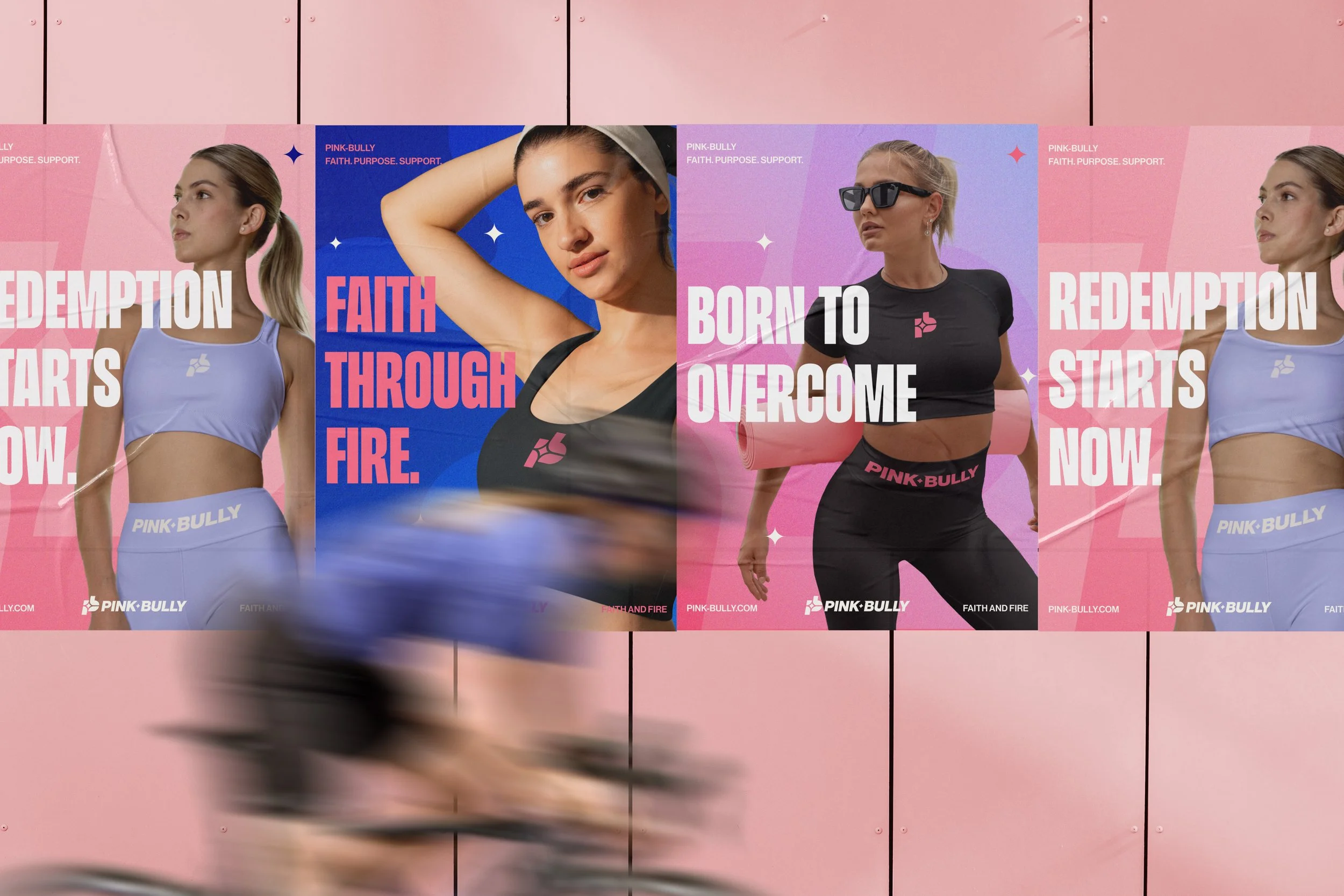 Several posters with athletic women promoting Pink Bully, a fitness brand, displayed on a pink background. The posters feature women in workout clothing with motivational slogans such as "Redemption Starts Now," "Faith Through Fire," and "Born to Ove