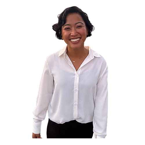 A woman with short, curly black hair smiling and wearing a white button-up shirt.