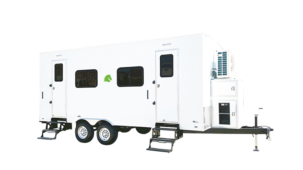 A white mobile tiny home trailer with three windows, a small green leaf logo, and entrances with steps, set against a black background.