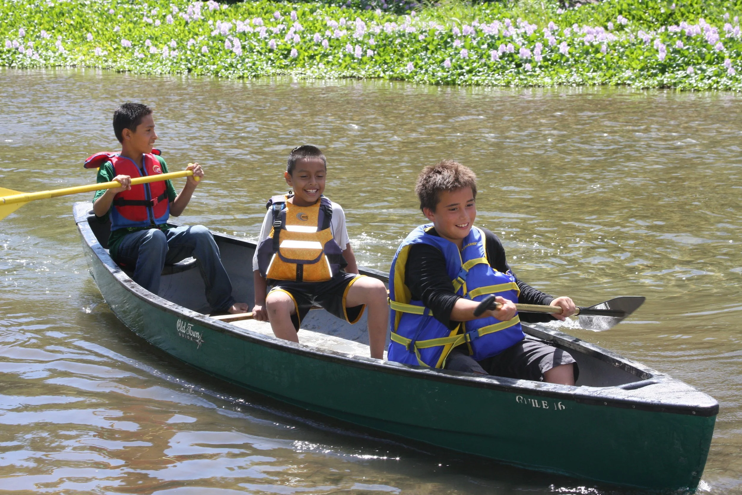 3 boys in canoe.JPG