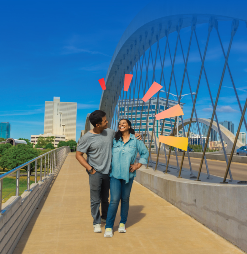 Couple on bridge smiling