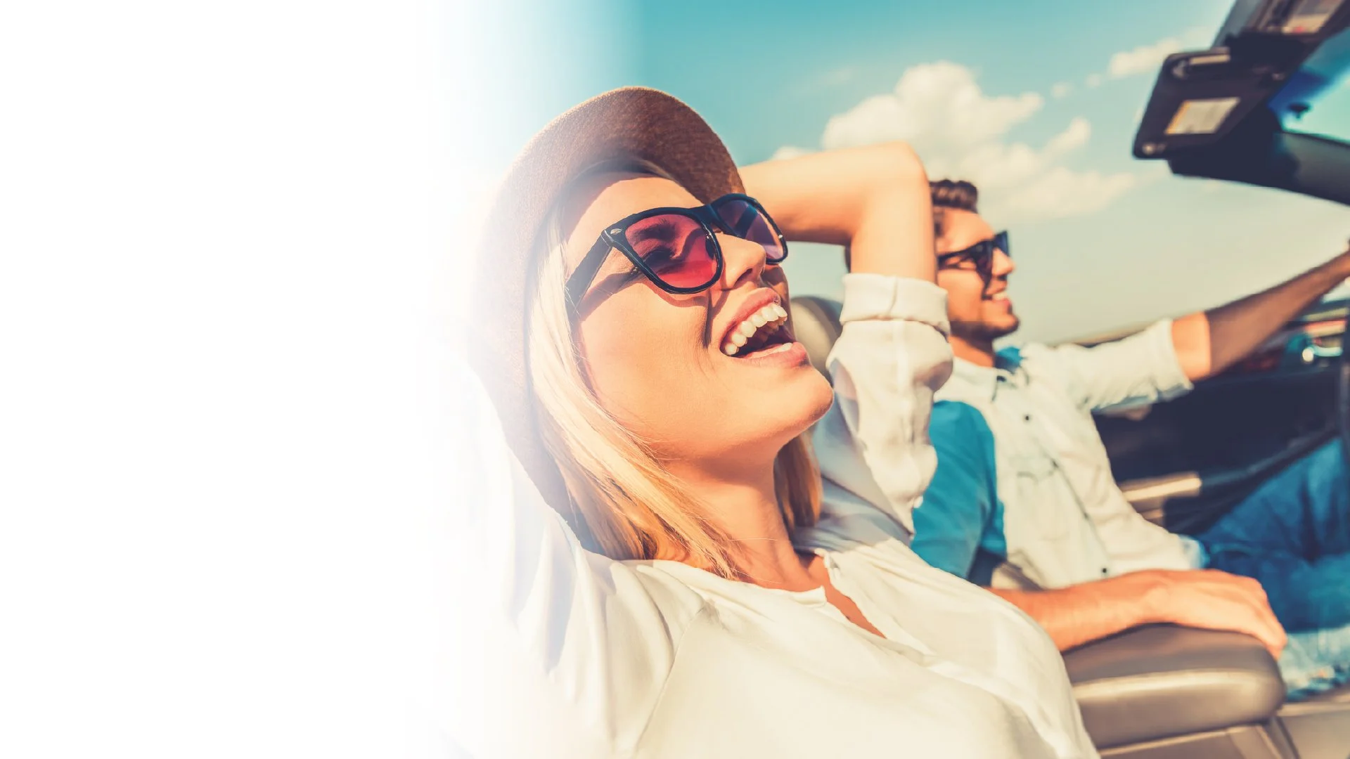 Someone riding in a car enjoying the sun