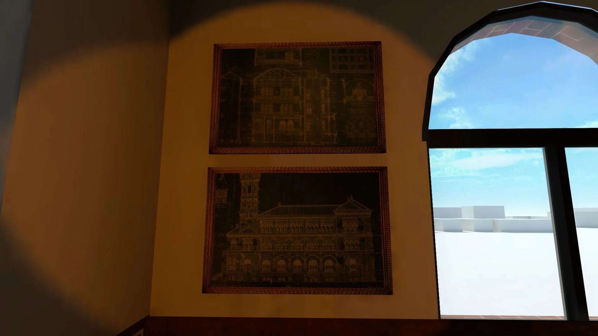 Interior of a room with two framed architectural drawings on the wall and a large window showing a blue sky with clouds outside.