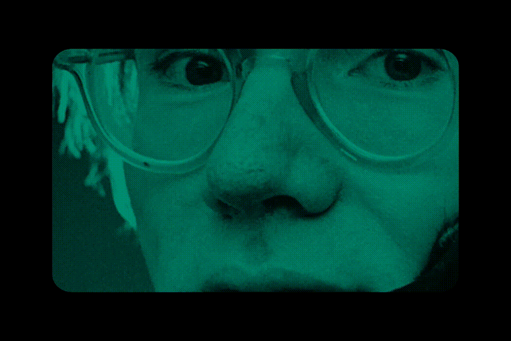 Close-up of Andy Warhol's face taken with a several color-tinted filters.