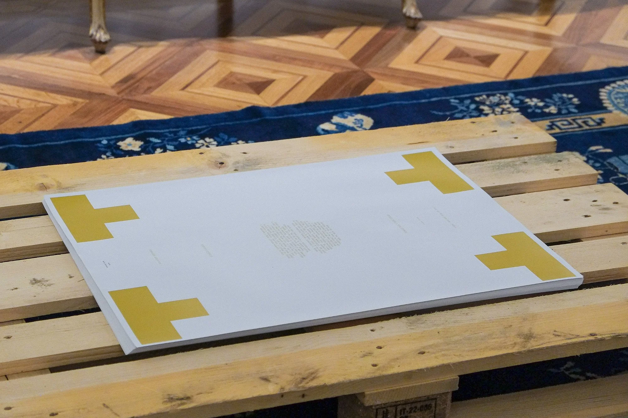 One of the posters placed on a wooden pallet