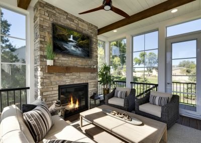 Cozy Three-Season Porch with Stone Fireplace &amp; Cedar Accents | Eden Prairie, MN