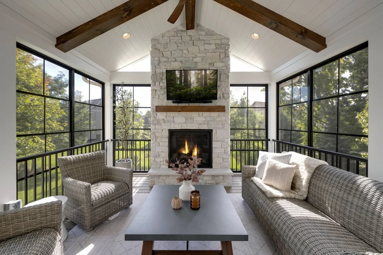 Cozy Three-Season Porch with Stone Fireplace &amp; Barnwood Beams | Savage, MN