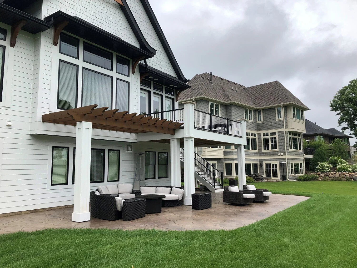 Trex Deck with Pergola &amp; Limestone-Capped Posts | Minnetrista, MN