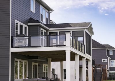 Three-Season Porch &amp; Deck with Stone Fireplace and Glass Railings | Plymouth, MN