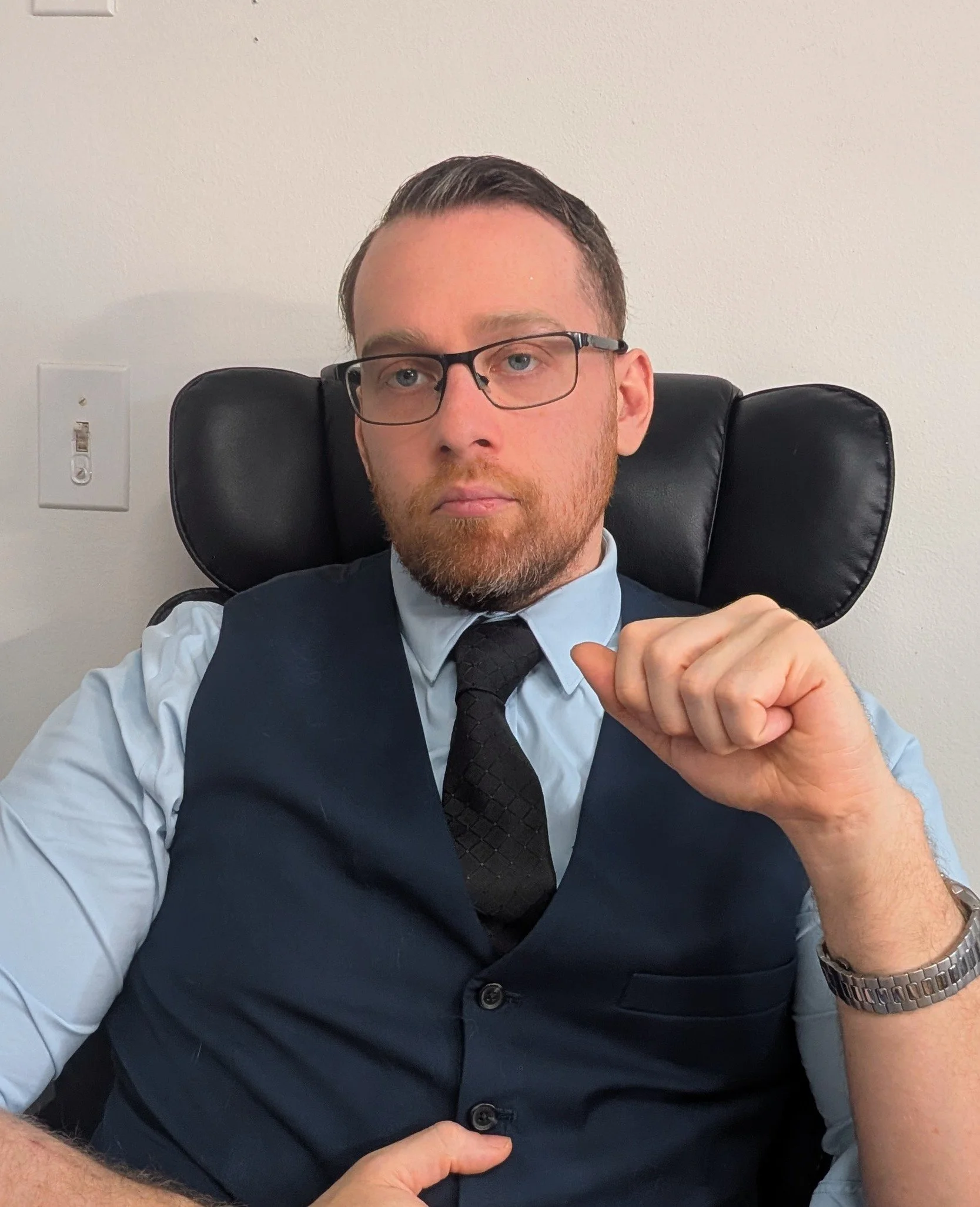Psychiatric nurse practitioner seated in a clinical office setting, representing professional telehealth mental health care.