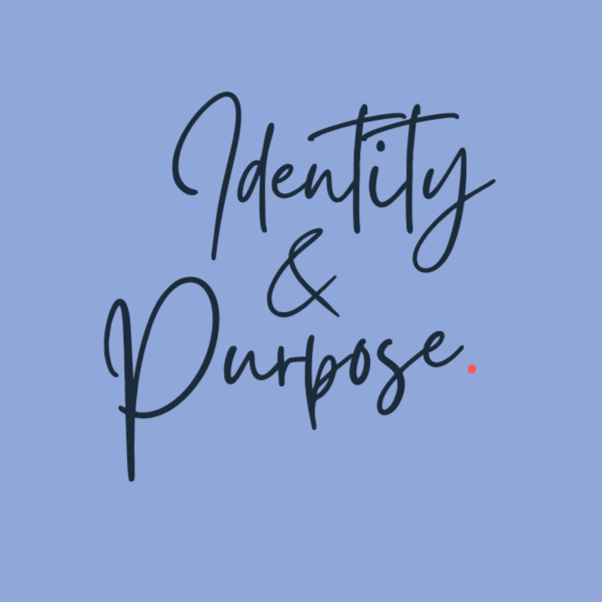 Vivien Moriarty, Mental Wellbeing Coach, with short dark hair laughing while sitting in a cozy chair with a striped shirt and pink cardigan, near a window with blurred greenery outside.