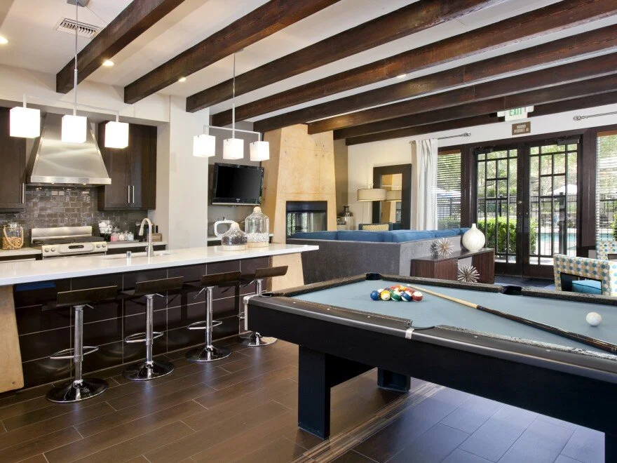 Clubhouse at The Overlook at Rancho Belago with pool table and bar with bar stools. 