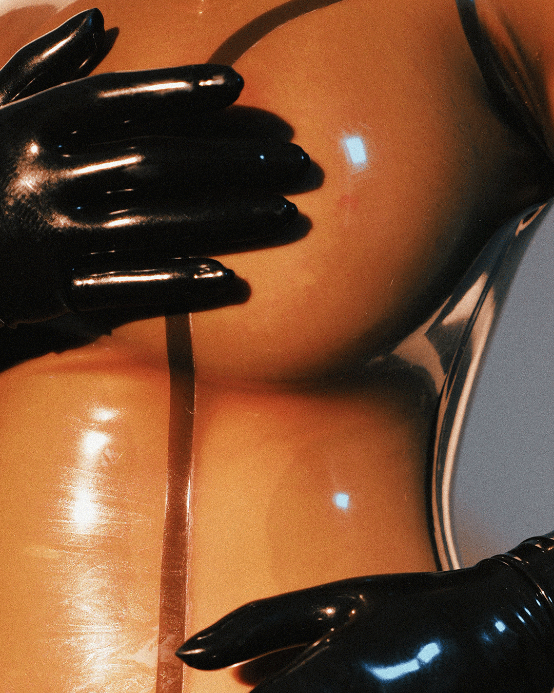 MarieOnCamera-SmokeyBlackTransparentLatexCatsuit-Carousel1_06.gif