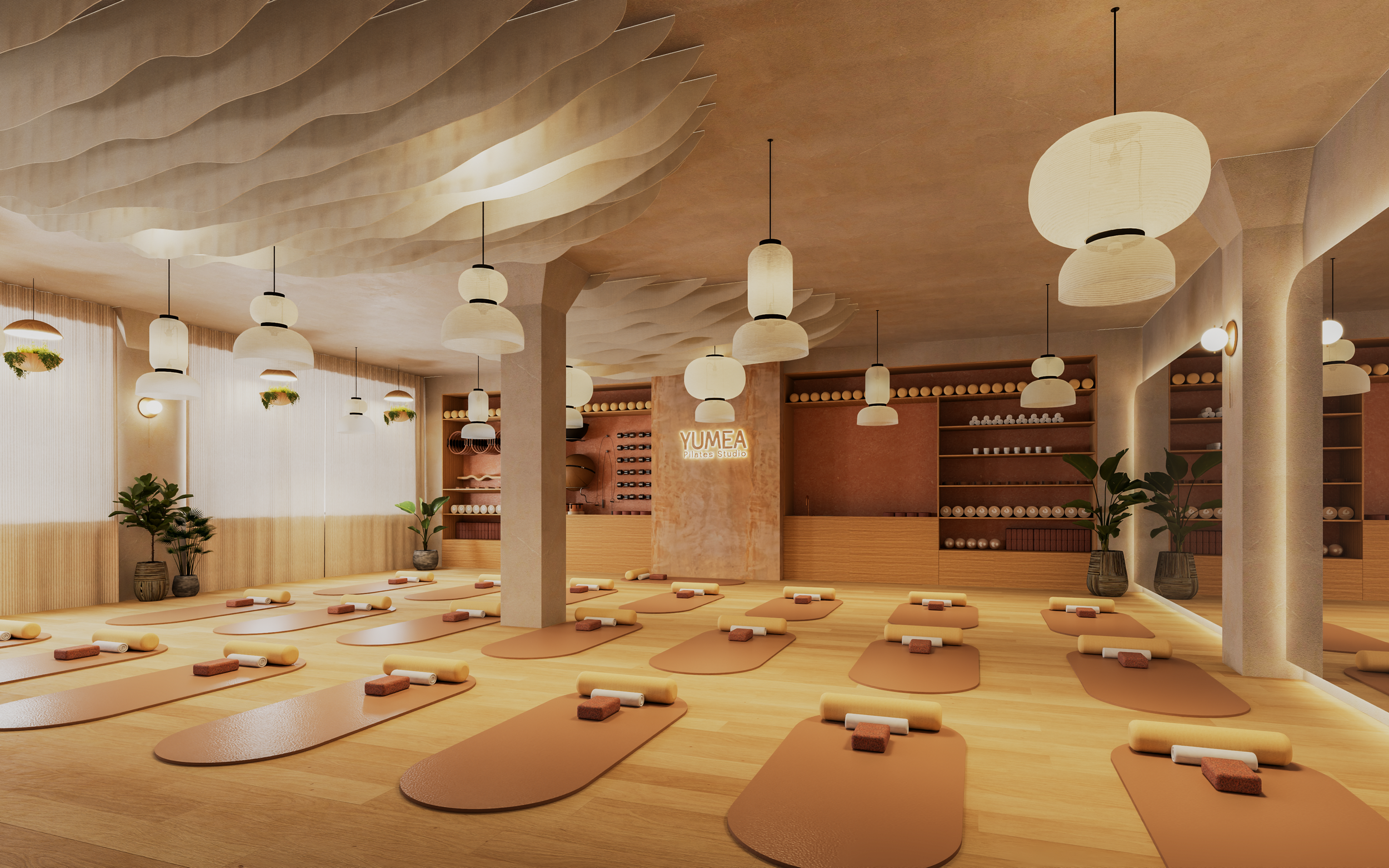 Grande salle de cours collectifs du studio Pilates et Yoga avec plafond acoustique et sol en bois. Spacious group class room in the Pilates and Yoga Studio featuring acoustic ceiling and wood flooring.