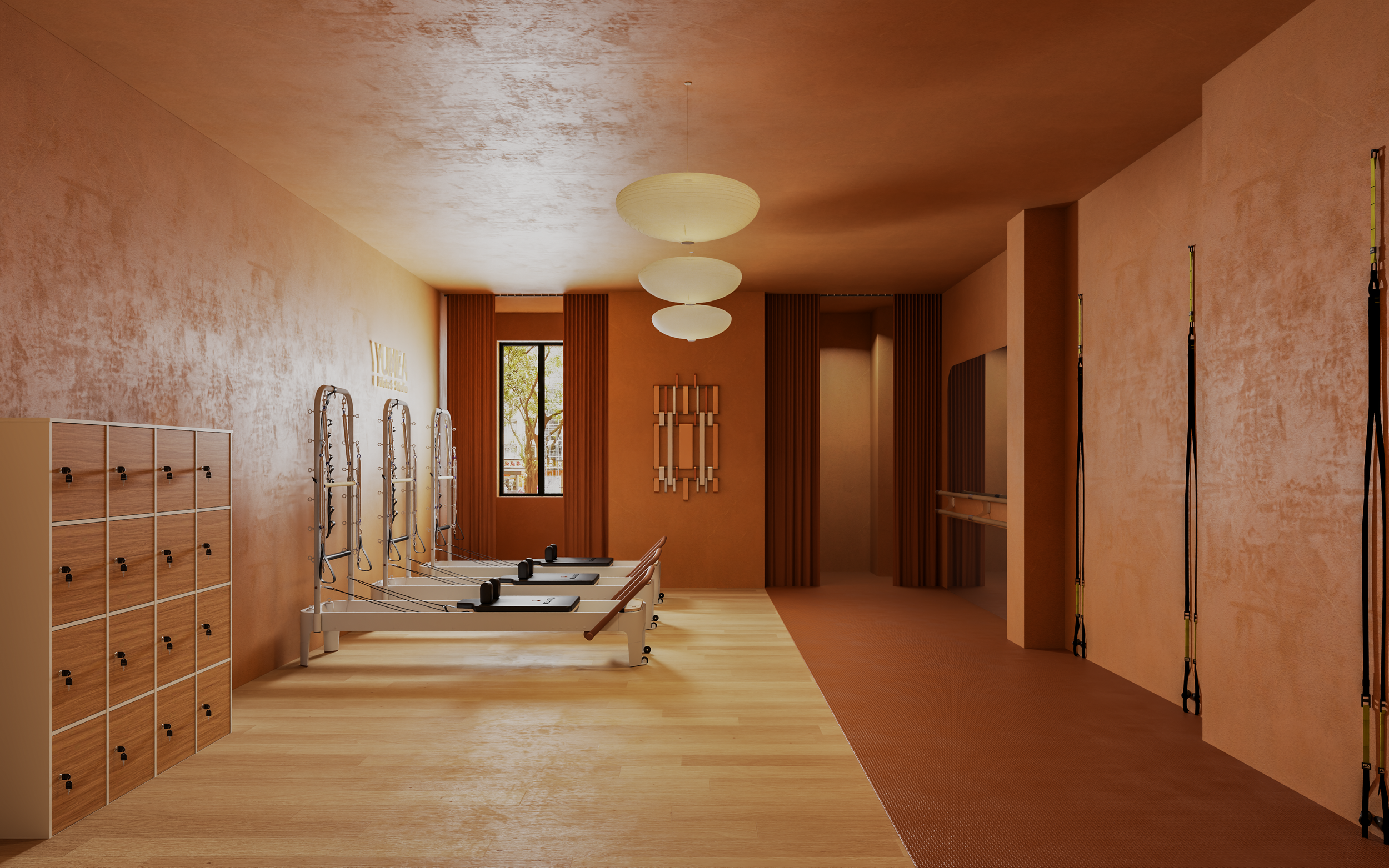 Salle privée Reformer dans le studio Pilates et Yoga : tons terracotta et miroirs en arches. Private Reformer room in the Pilates and Yoga Studio: terracotta tones and arched mirrors.