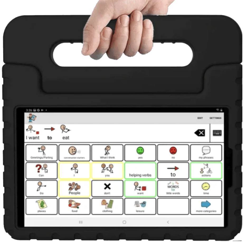 A hand holding a tablet with communication symbols and words on the screen, used for assisted communication.