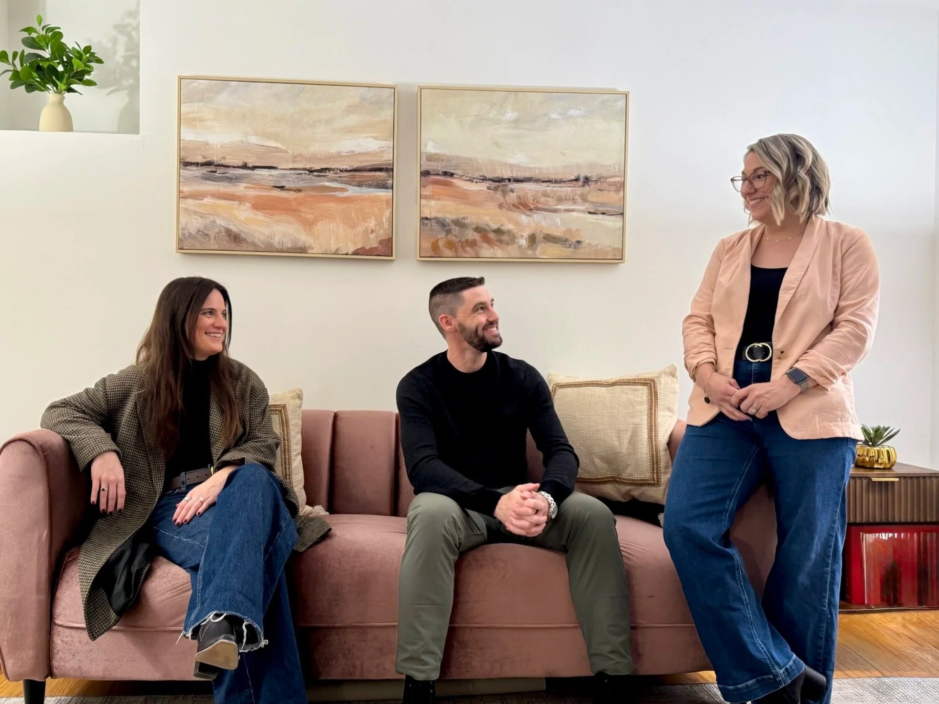 therapists sitting on pink couch