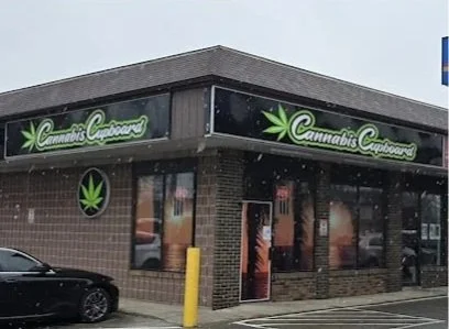 Cannabis Canvass store with a sign and logo featuring a cannabis leaf
