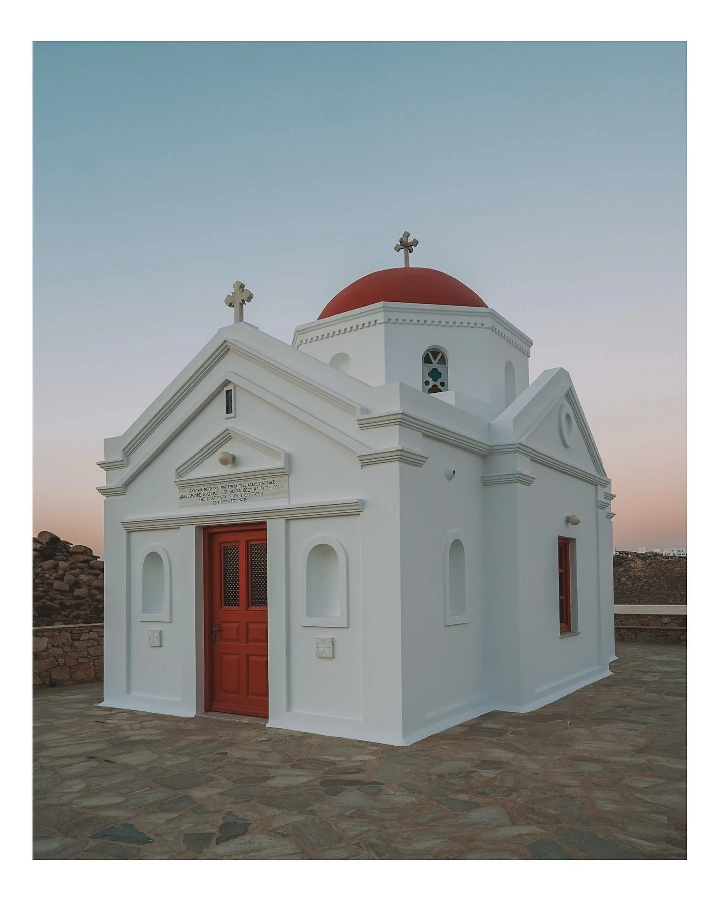 Mykonos - Greece

I know that this is not the most typical photo we see  from Mykonos, but to me the churches of Mykonos became one of my fondest photography takeaways. There are 600 of them through the island, so you can&rsquo;t miss them or not won