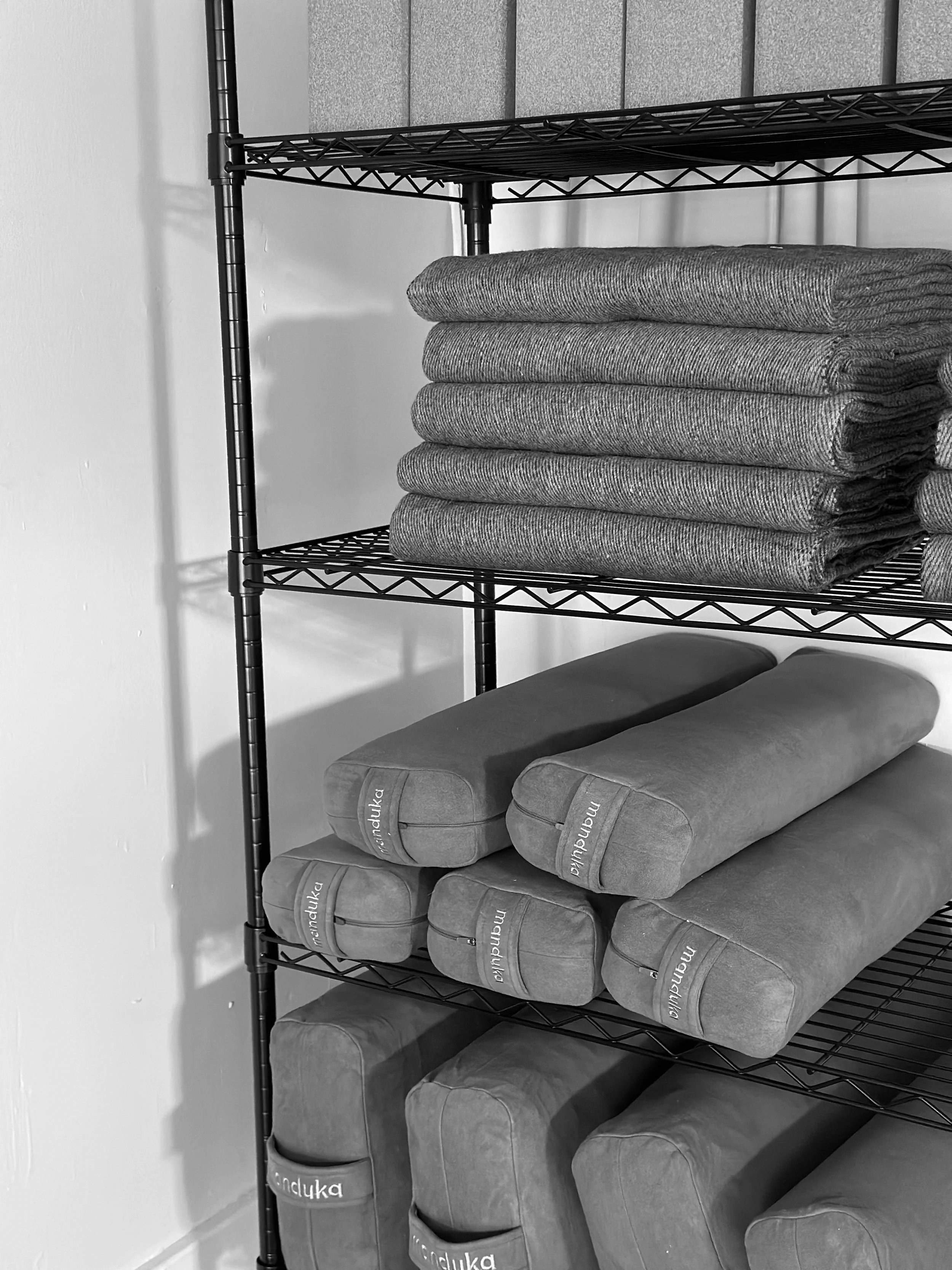 manduka props used at the studio - folded wool blankets, bolster pillows, cork yoga blocks