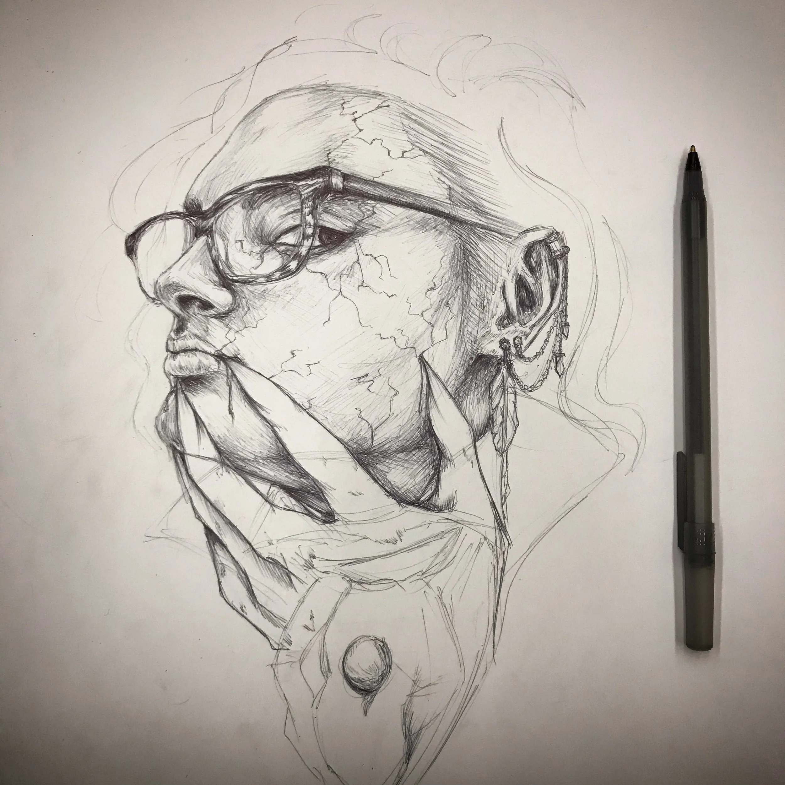 A detailed pencil sketch of a person with long flowing hair, wearing glasses, earrings, and a shirt, with emphasis on facial features and textures.