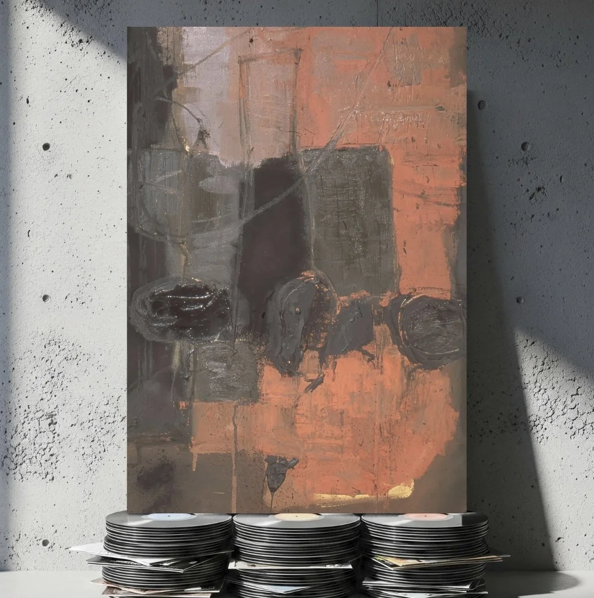 Abstract painting with dark tones and textured patterns, displayed on a wall with stacks of vinyl records at the bottom.