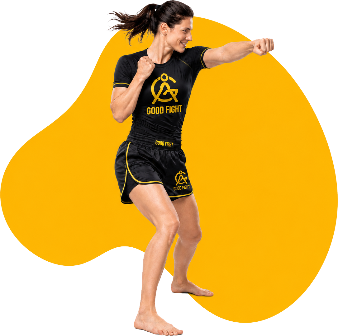 Woman practicing a straight punch in Good Fight training gear.png