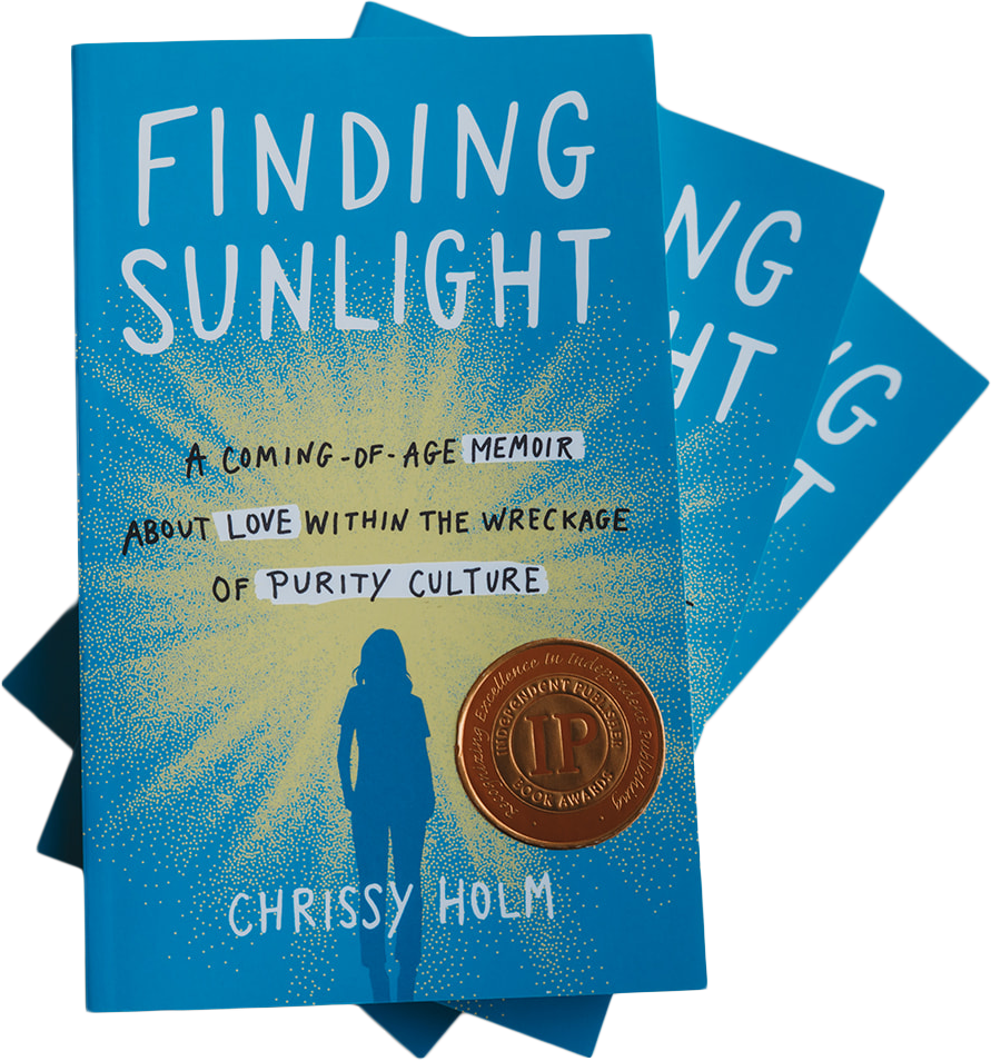 A blue book titled 'Finding Sunlight' by Chrissy Holm with a quote about love and purity, featuring a silhouette of a person and an awarded bronze medal sticker on the cover.