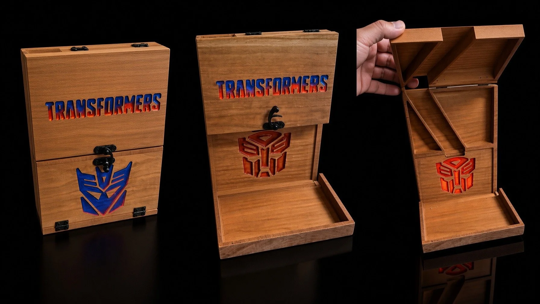 Three wooden storage boxes with Transformers logos and text, one open showing interior compartments.