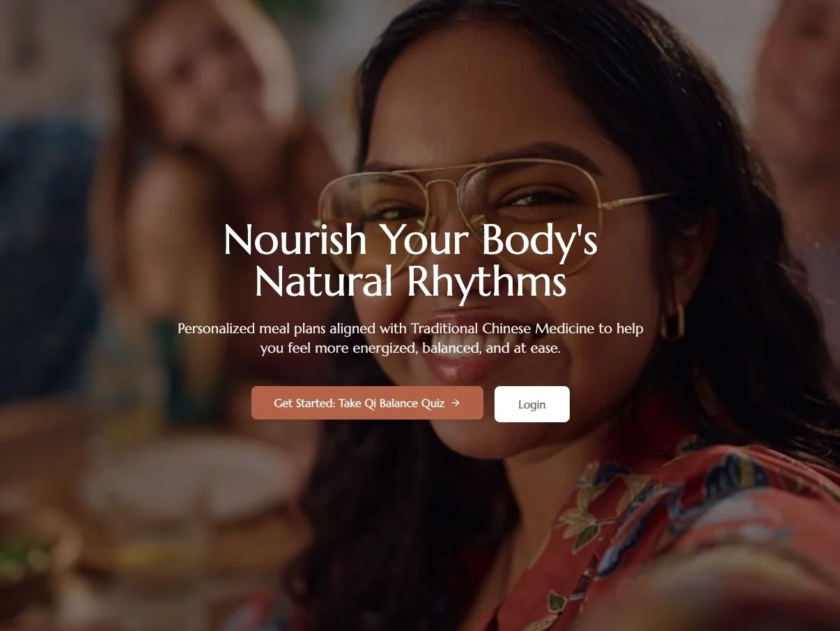 Close-up of a woman with glasses smiling, with blurred people in the background, promoting personalized meal plans based on Traditional Chinese Medicine.