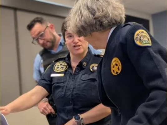 Founder Dr. Meg Marino and New Orleans Chief of Police Kirkpatrick in a strategic planning meeting