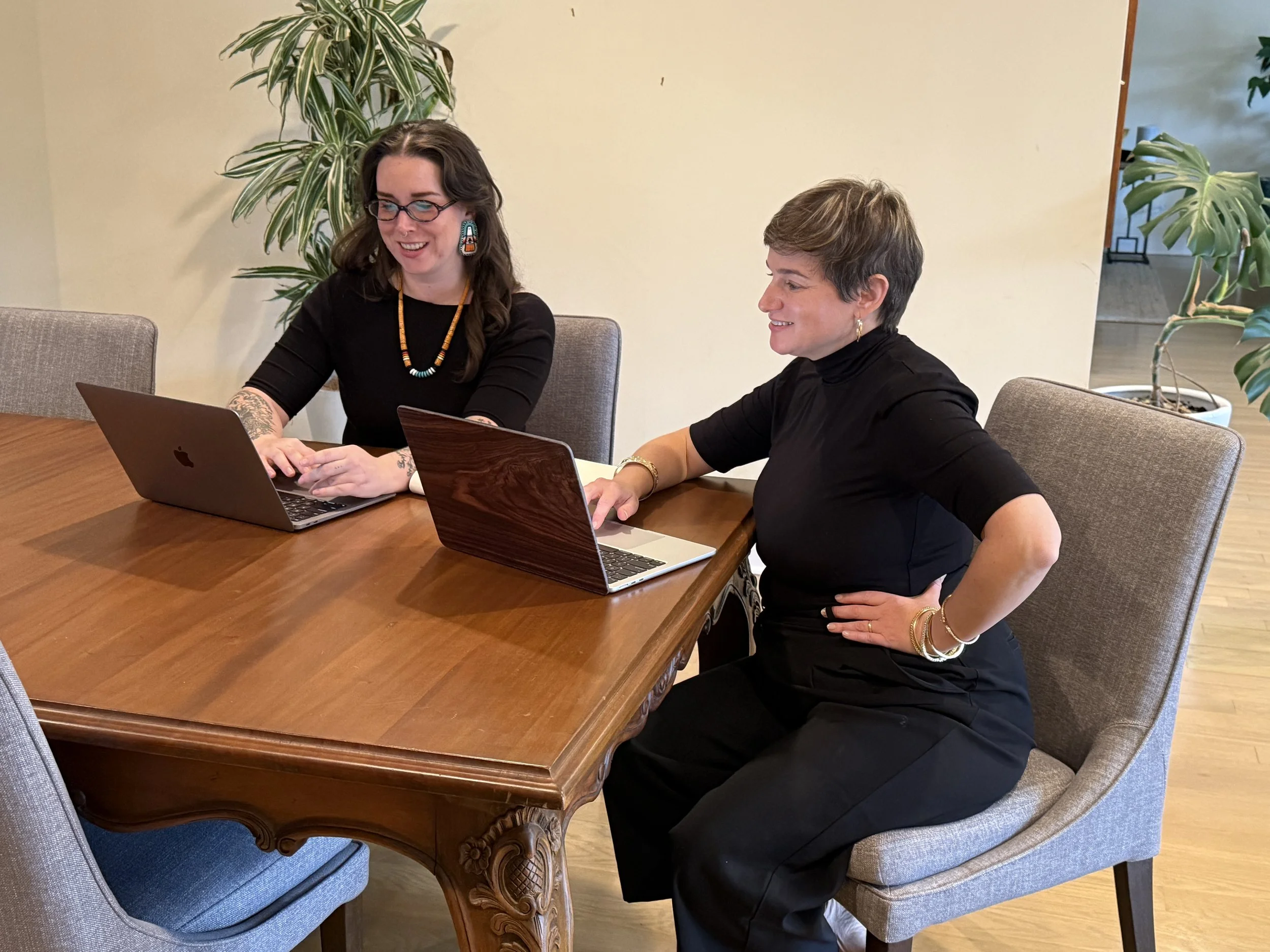 Founder Dr. Meg Marino and Senior Paramedic Consultant Jessica Barbour at Manifest EMS offices working on laptop