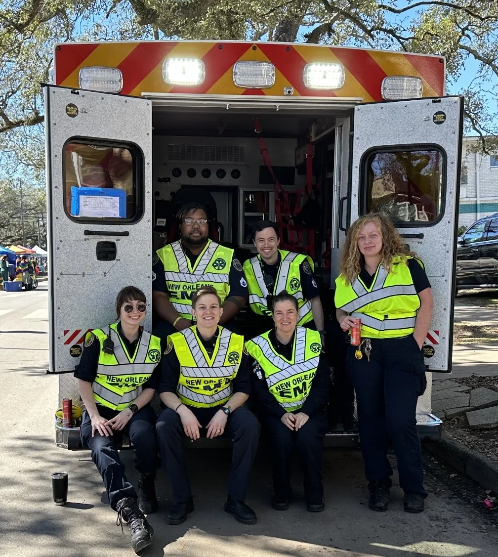 Founder Dr. Meg Marino with New Orleans EMS crew during Mardi Gras 2024