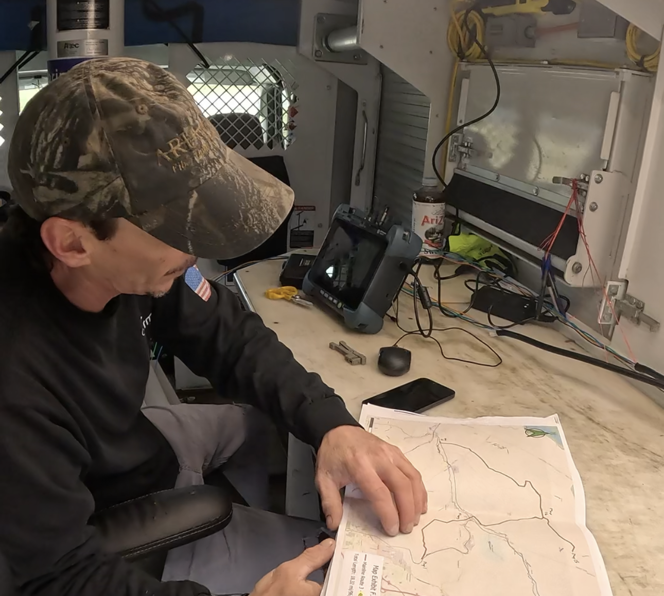 Infrastructure field team reviewing plans before execution to support consistent project delivery