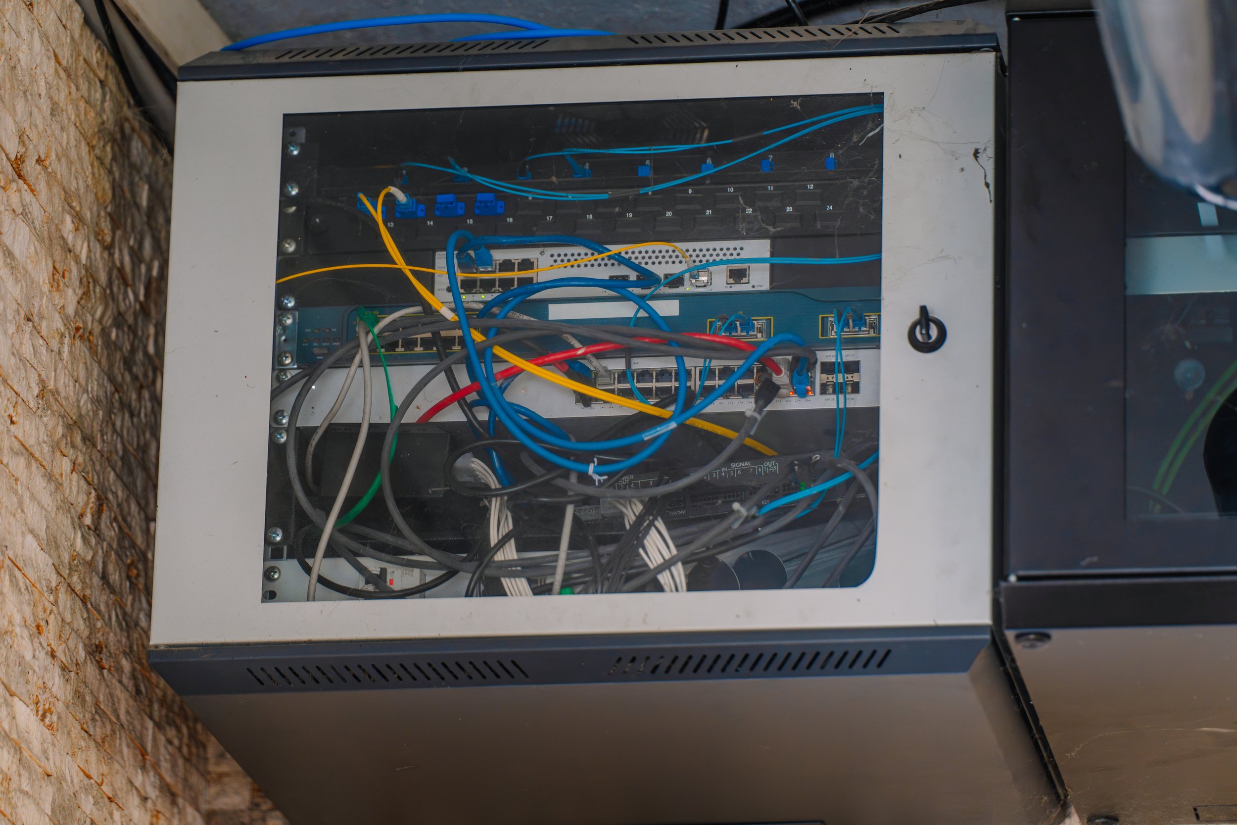 Fiber distribution panel where multiple providers connect to a shared open access network