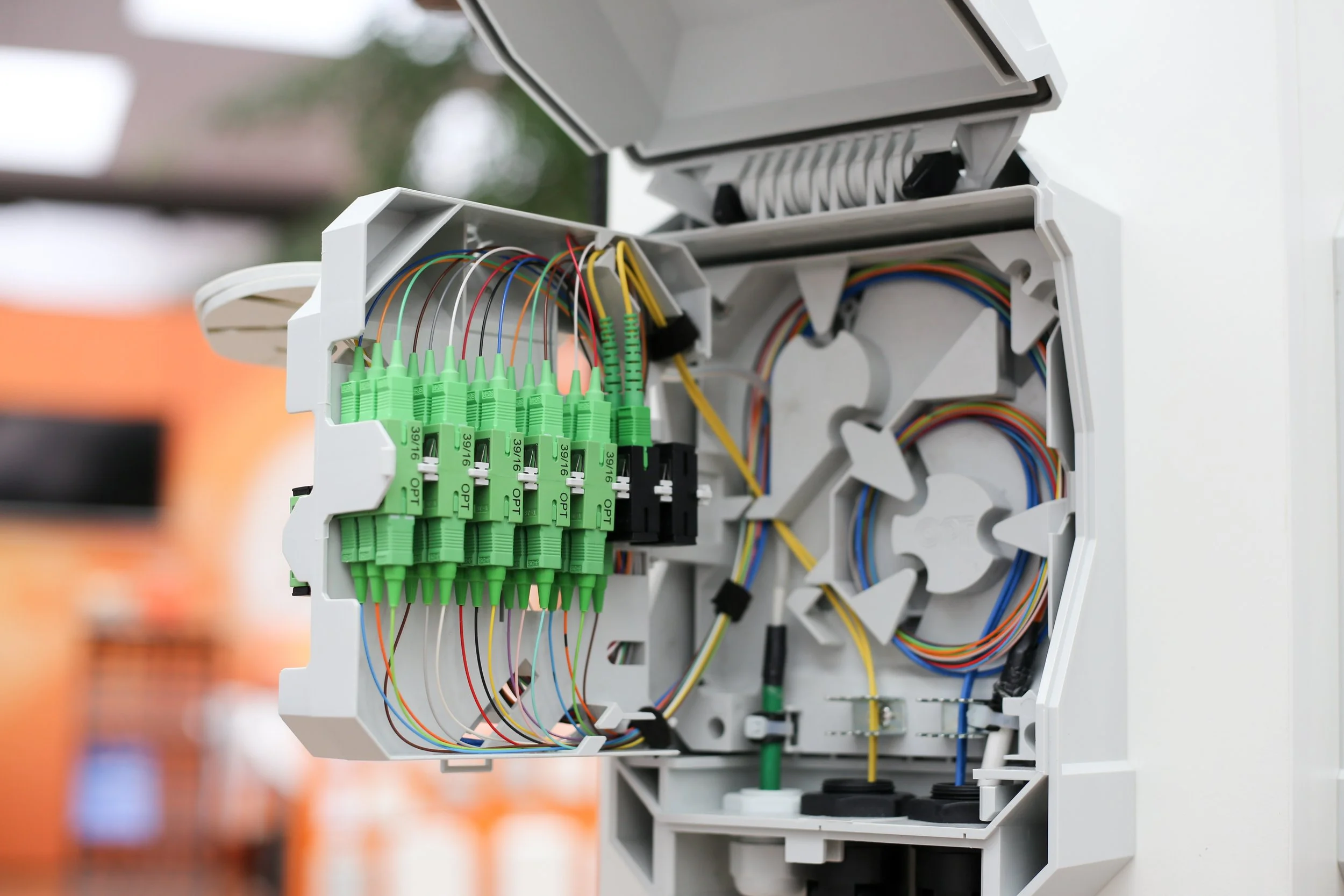 Fiber optic patch panel with multiple mated connector pairs, each contributing measurable insertion loss to a link's total loss budget.
