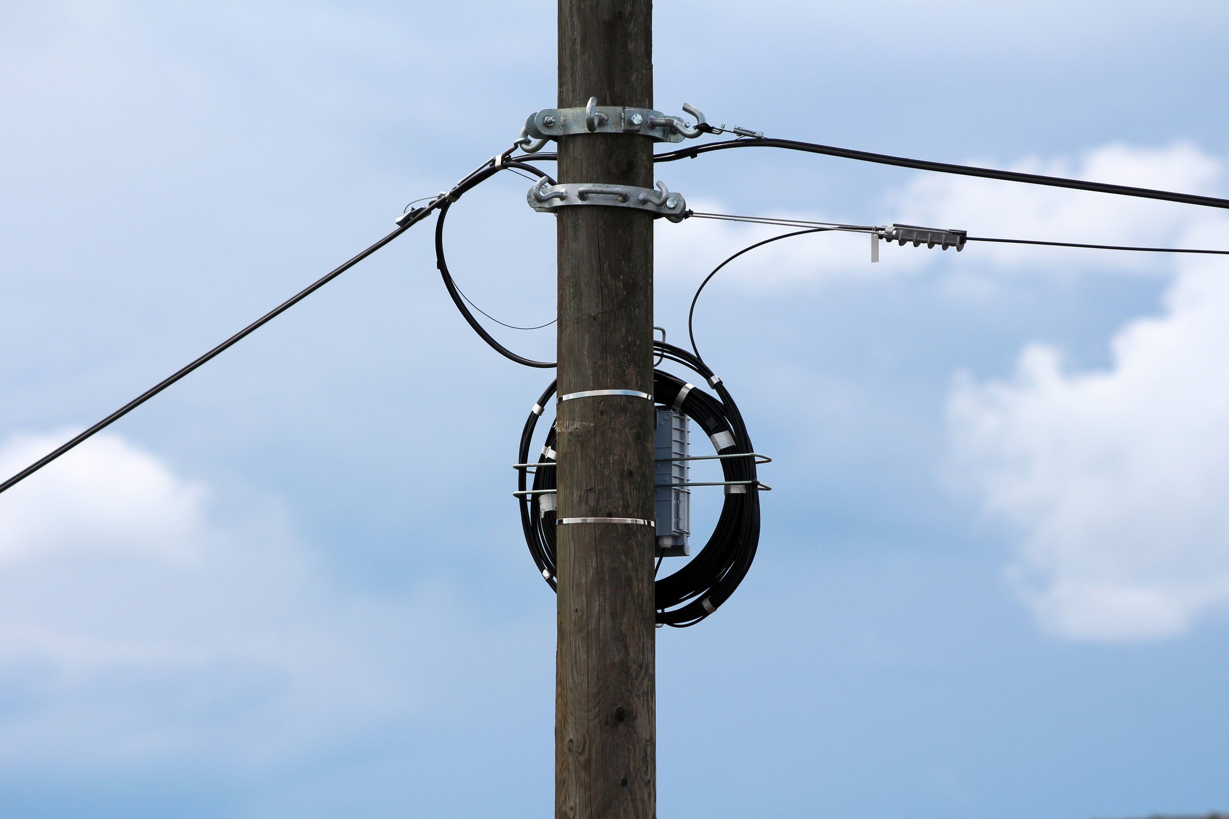 ADSS vs. OPGW vs. Figure-8: Choosing the Right Aerial Fiber Cable for Your Build
